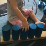 Child building with wooden blocks at daycare